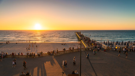 Adelaide, South Australia - January 12, 2019: Glenelg Beach jetty with people walking along at sunset viewed from Giant Ferris Wheel at Moseley Squareのeditorial素材