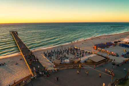 Adelaide, South Australia - January 12, 2019: Moseley Beach Club with people resting at sunset viewed from Giant Ferris Wheelのeditorial素材