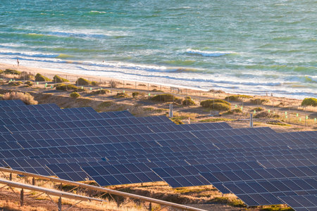 Solar panels installed along the coastline at sunset in South Australia