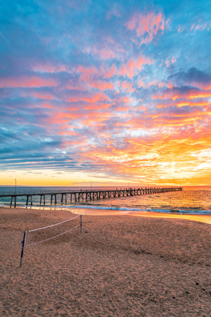 Port Noarlunga beach with with beach volleyball area at sunset, South Australia