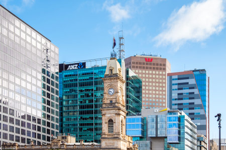 Adelaide, South Australia - August 19, 2019: Old General Post Office clock tower with modern office...