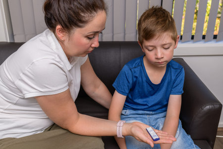 Mother doing the COVID-19 rapid antigen test for her son at home