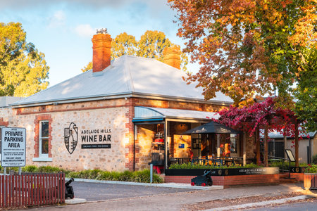 Hahndorf, Adelaide Hills, South Australia - April 27, 2021: Adelaide Hills Wine Bar during autumn season viewed from the Main street at sunsetのeditorial素材