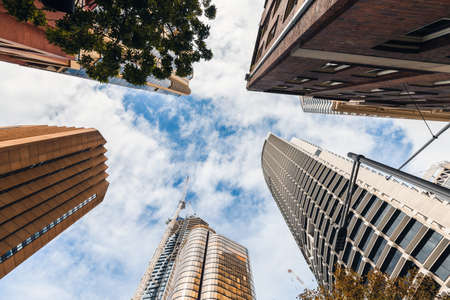 New skyscrapers at The Rocks in Sydney city while looking up up on a dayの写真素材
