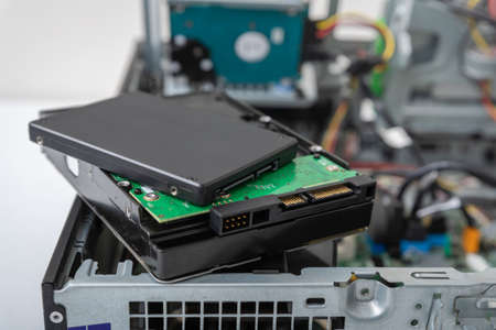 Closed-up view of SSD and spindle hard disks on top of business desktop PCの写真素材