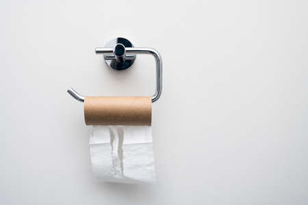 Toilet paper empty roll hanging on the wall. Epic fail conceptの写真素材