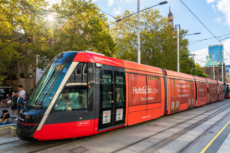 Sydney, NSW, Australia - April 16, 2022: Sydney city light rail tram stopped at Town Hall while viewed along George street on a dayのeditorial素材