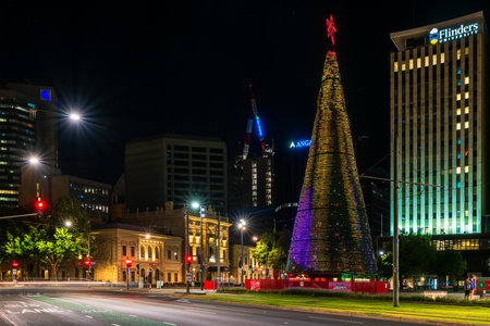 Adelaide, Australia - January 2, 2022: Big Christmas Tree installed at Victoria Square in Adelaide CBD while illuminated at night time.のeditorial素材