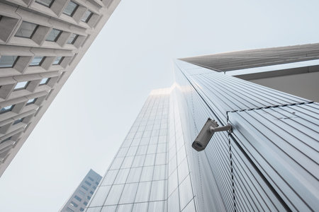 Outdoor CCTV video surveillance security camera installed on the building in the city
