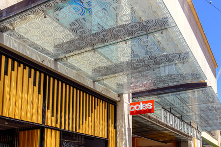 Adelaide, South Australia - December 28, 2022: Coles Supermarkets logo sign above entrance to Rundle Place shopping center in Adelaide CBD while viewed from Rundle Mall on a bright dayのeditorial素材