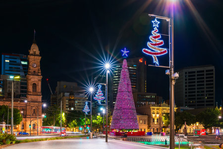 Adelaide, Australia - January 2, 2022: Big Christmas Tree installed at Victoria Square in Adelaide CBD while illuminated at night time.のeditorial素材