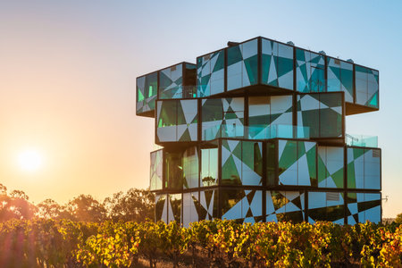 McLaren Vale, South Australia - April 4, 2021: The d'Arenberg Cube building in vineyards at sunset. It includes restaurant, wine tasting room, virtual fermenter, 360-degree video room and Alternate Realities Museum and is popular tourist attraction.のeditorial素材