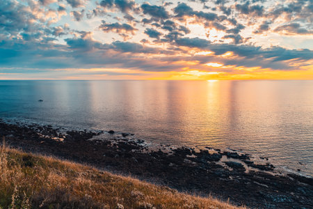 Hallett Cove rocky shore with calm ocean at sunset in South Australiaの写真素材