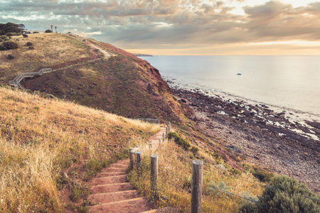 Marion to Hallett Cove Coastal Walking Trail downhill and uphill with sea view at sunset, South...
