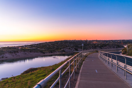 Port Noarlunga shared footpath and bike track along the Onkaparinga River at dusk, South Australiaの写真素材