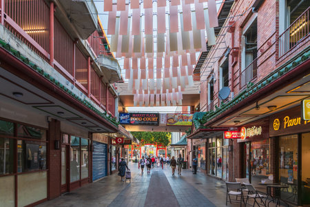 Adelaide, South Australia - December 19, 2020: Cafes, restaurants and boutiques with people in Adelaide City Chinatown centre viewed towards Gouger Street entrance on an afternoonのeditorial素材