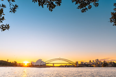 Sydney, Australia - April 20, 2022: Sydney Opera House with Harbour Bridge and North Sydney at sunset timeのeditorial素材