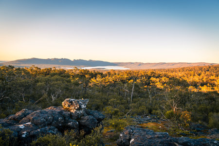 Grampians mountains landscape with native trees viewed towards Wartook Reservoir at sunset, Victoria, Australiaの写真素材