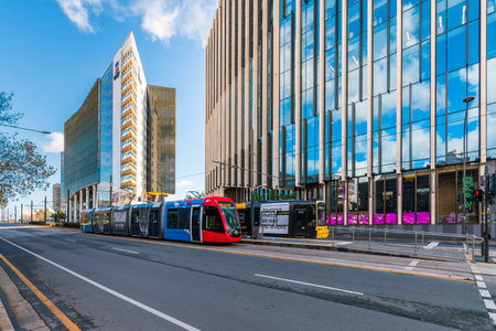 Adelaide, South Australia - July 14, 2024: The University of Adelaide North Terrace campus with trams at the stop viewed from the street on a dayのeditorial素材