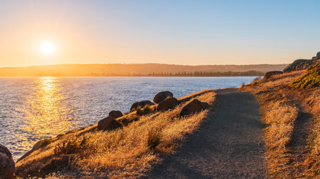 Scenic pathway along the coast of Granite Island at sunset, Encounter Bay, South Australia