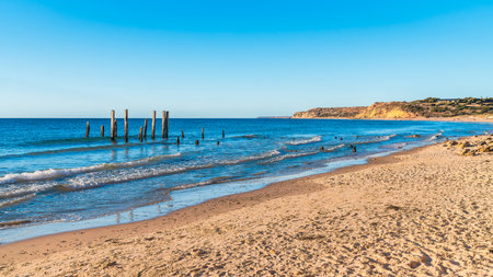 Port Willunga beach with jetty remains during sunset time, Fleurieu Peninsula, South Australiaの写真素材