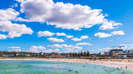 Sydney, NSW, Australia - April 20, 2022: People enjoying warm weather while relaxing along famous...