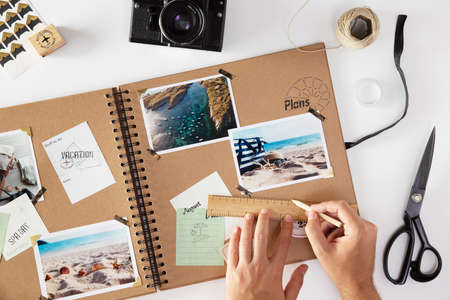 beautiful scrapbook with travel photo and beautiful capsules and amazing view of sceneryの写真素材