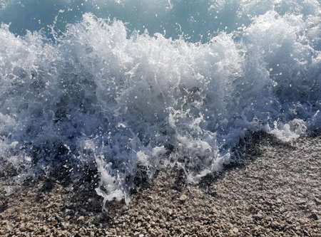 Sea foam on the beach, summer day 2020.の写真素材