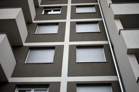 Facade, windows and shutters of the building, new construction.