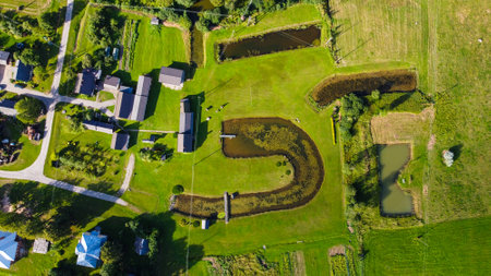 Aerial View of Rural Landscape with Ponds and Housesの写真素材