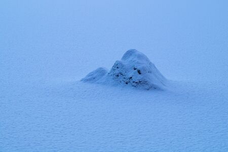 Rock covered in snow, snow texturedの写真素材