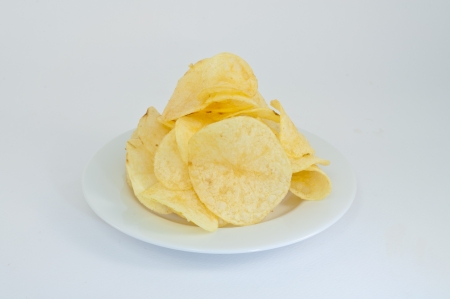 Potato chips, clipping path included on the white plateの写真素材