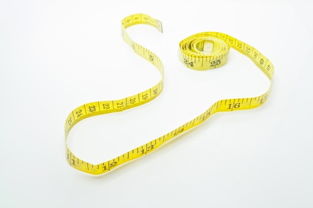 Measuring tape of the tailor for you design on a white background.の写真素材