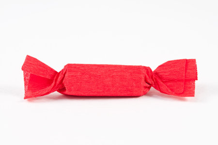 Candy in Red wrapper on white background