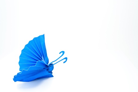 Origami Japanese blue paper butterflies on white background.の写真素材
