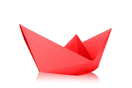 Close up origami paper ship on white background の写真素材
