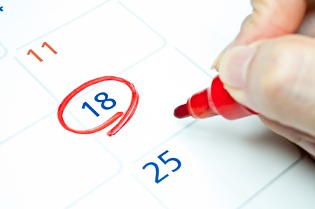 Red color  Mark on the calendar at 18 の写真素材