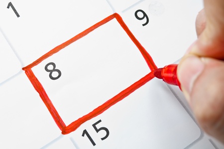 Red color writing on the calendar at 8 の写真素材