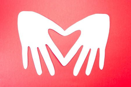 White Paper Heart. On a red background.の写真素材