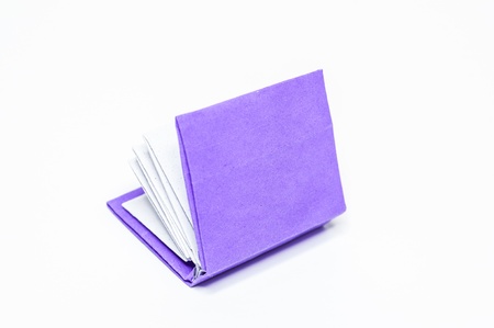 Purple book on a white background. Paper craft  and origami.の写真素材