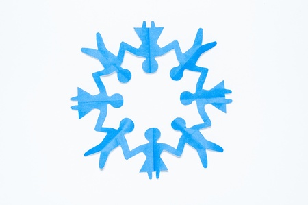 Blue Paper people holding hands in a circle of men and women. Paper reuse, Paper craft and origami.の写真素材