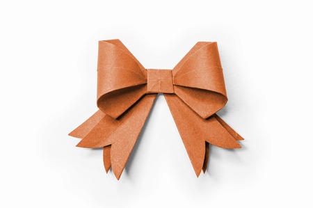Orange ribbon on white recycled paper. Paper craft .の写真素材