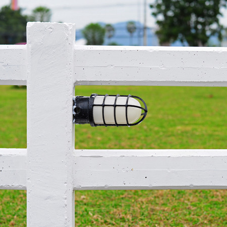 White lights affixed to the white fence.の写真素材