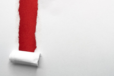 White paper torn into strips. Ground red paper.の写真素材