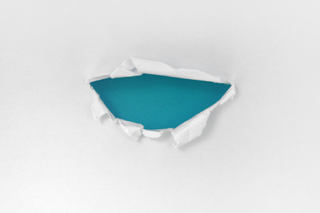 White paper torn semicircle shape beautiful. Beautiful blue backgroundの写真素材