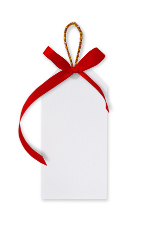 White paper tags and red ribbon bow, gold rope on white background.の写真素材