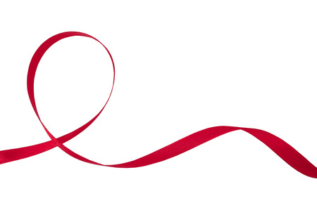 Red ribbon on a white background with clipping paths.の写真素材