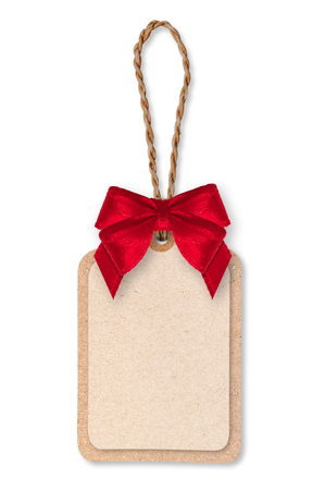 Brown Paper tag, rope and red ribbon bow on white background.の写真素材