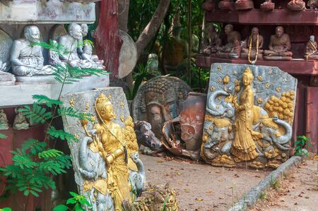 Abandoned religious art and sculpture at Thai public buddhist temple, selective focusの写真素材