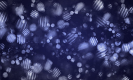 Abstract shiny glittering particle effect on deep blue background.